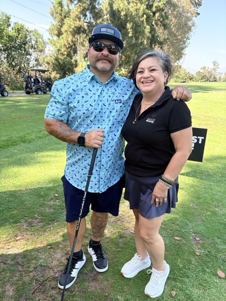 Two tournament guests at the 13th hole.